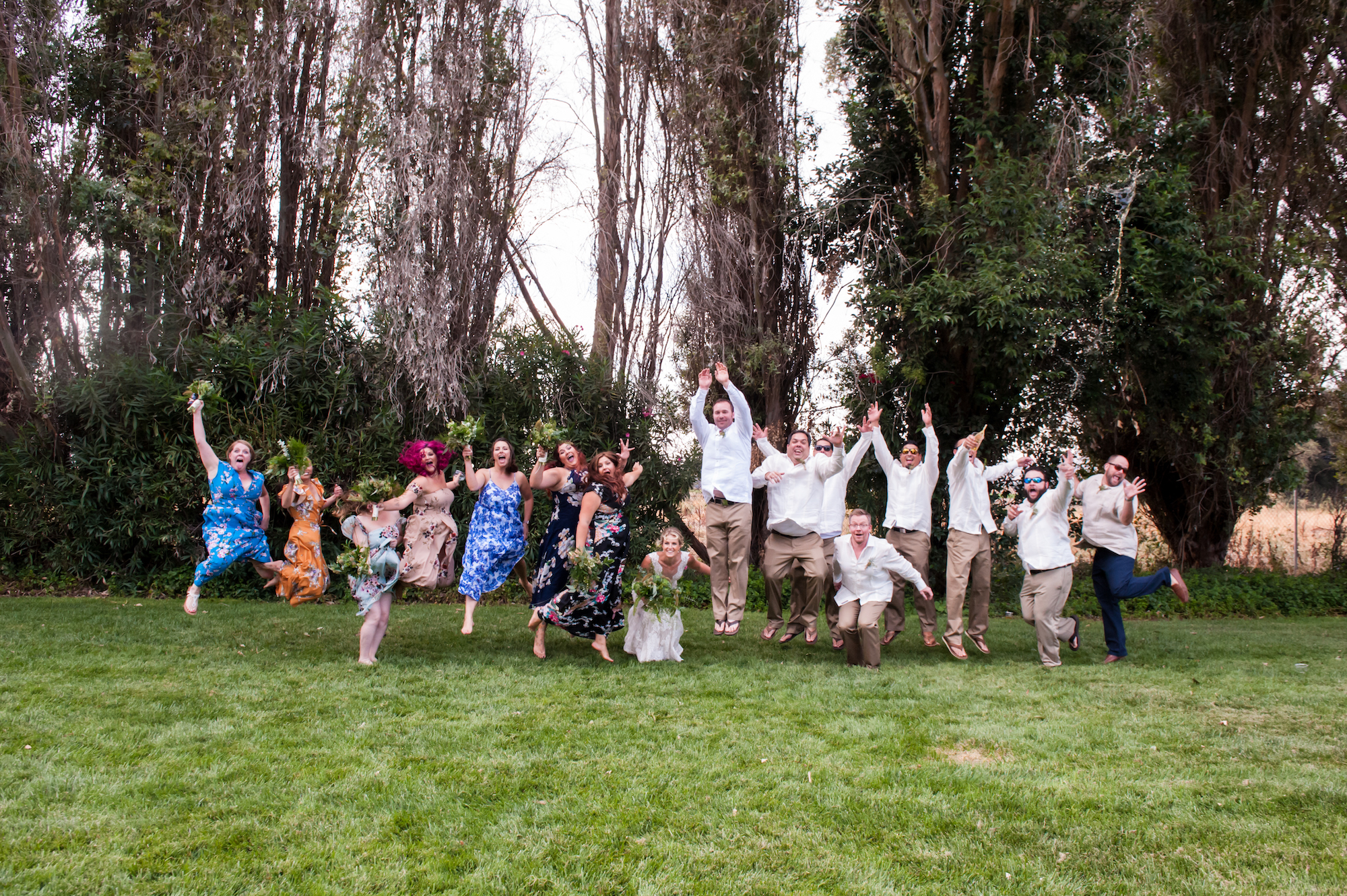jump shot of wedding party by jen vazquez photography JVP20170916AndyBrina-1196