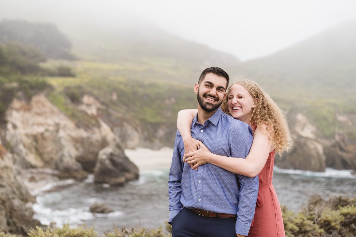 women and man in on the cliffs after a surprise proposal in Big Sur, california by photographer Jen Vazquez