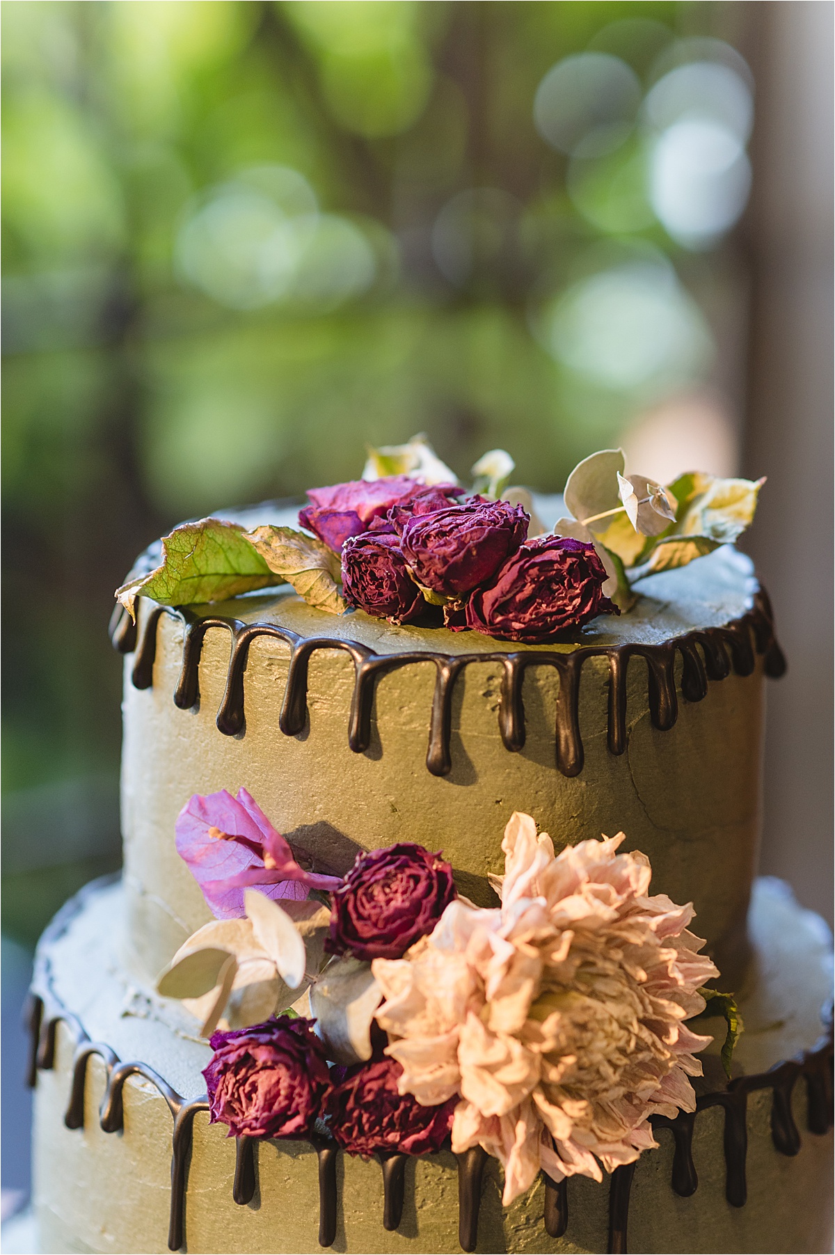 wedding cake for a Halloween wedding with florals on top