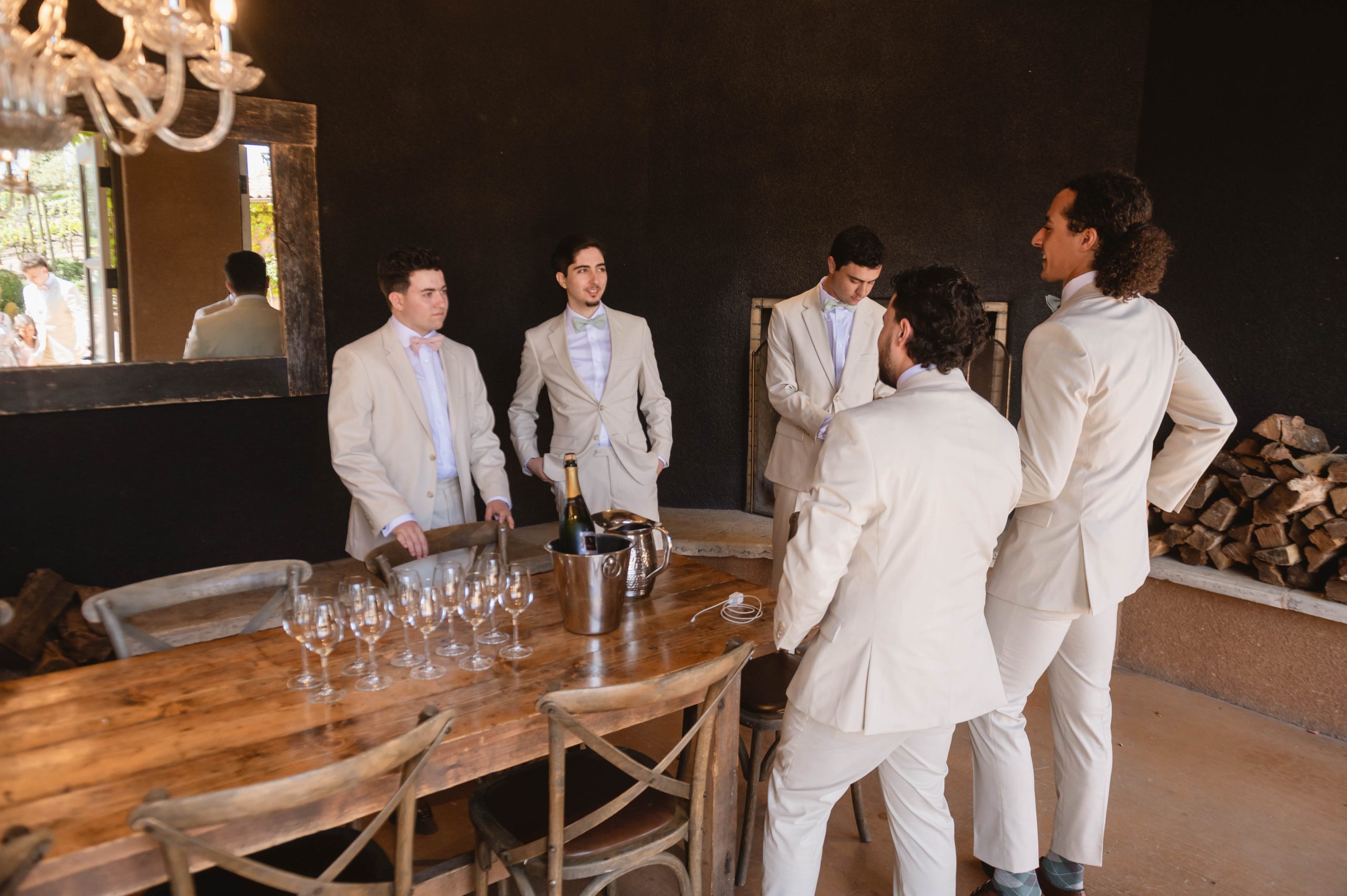 Groomsmen hanging out after getting ready at Viansa Grooms' room in Sonoma