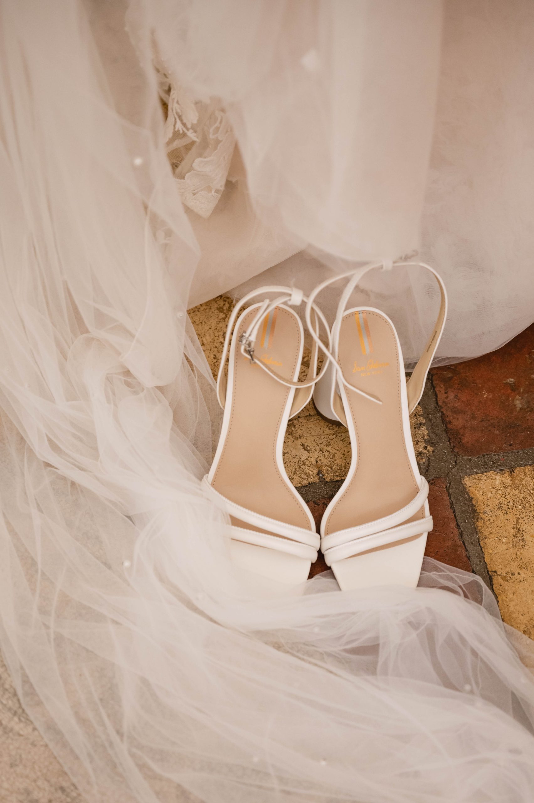 Close up of Wedding dress and shoes at Viansa Winery in Sonoma by Jen Vazquez Photography