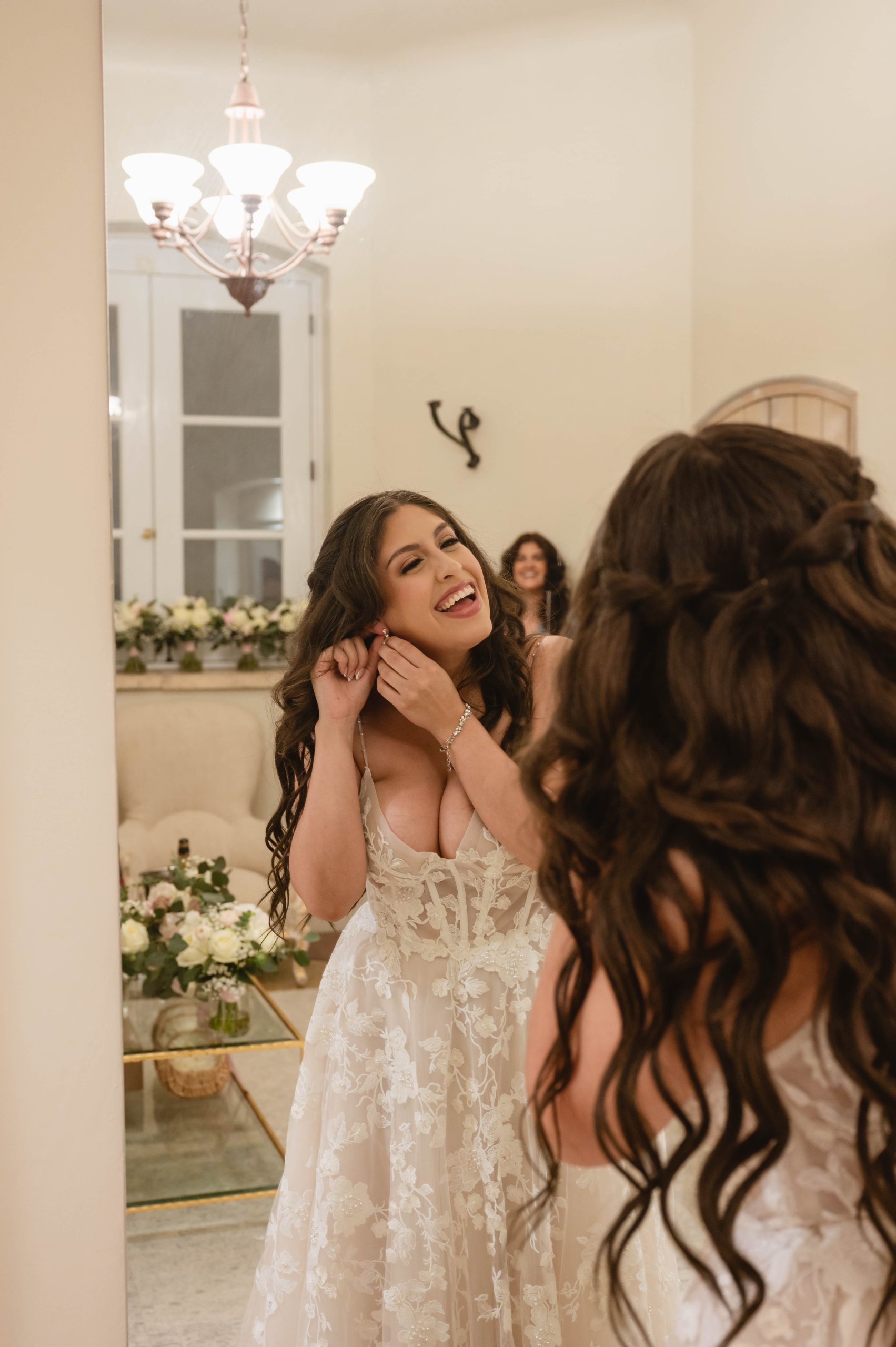 Bride putting on the Earings at Viansa Winery in Sonoma by Jen Vazquez Photography
