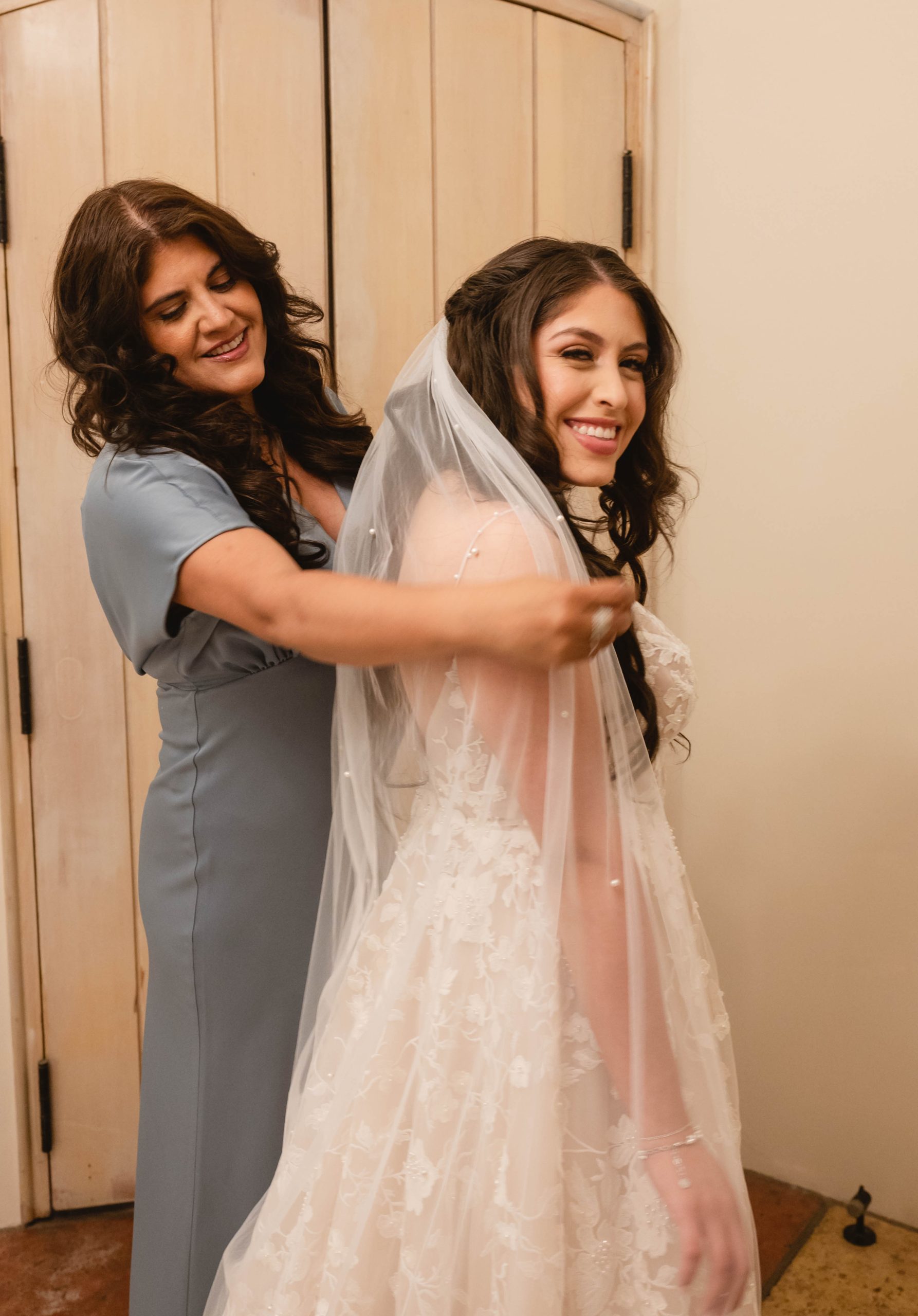 Mother of the Bride MOB and Bride putting on veil at Viansa Winery in Sonoma by Jen Vazquez Photography