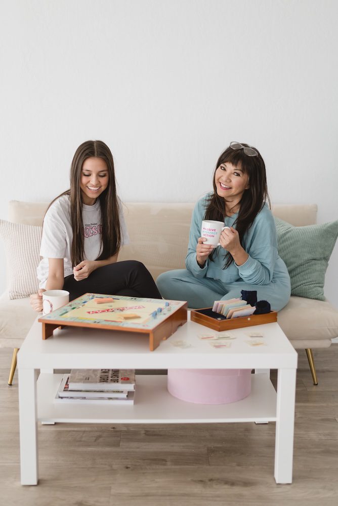 Monina Wright and her daughter playing monopoly for her brand photography photoshoot in Los Altos, California at the Sunlight Space talking about brand photos