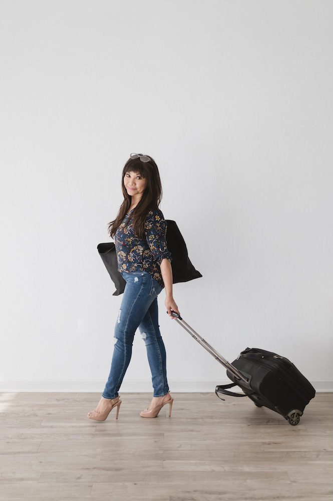 Monina Wright of Moderne Beauty walking with her makeup bag in the Los Altos studio The Sunlight Space by photographer Jen Vazquez