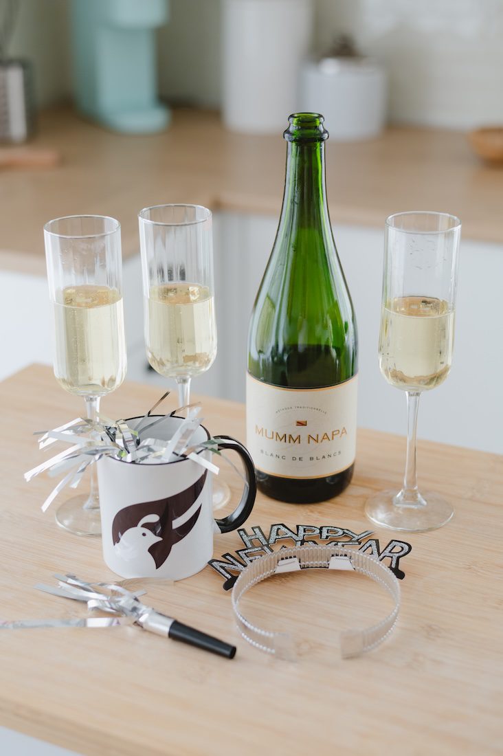 Happy New Year! with champagne bottle, glasses