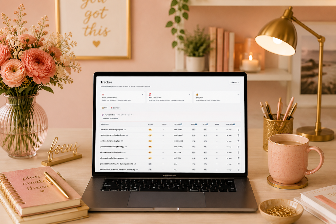 feminine office in peach with gold accents and a macbook pro laptop with Pinterest keyword research with Jen Vazquez
